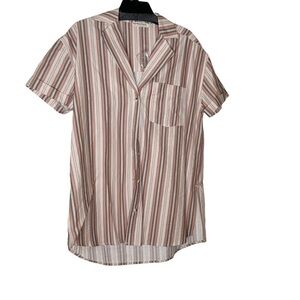Free People oversized buttoned down shirt. Collared with breast pocket.Size XS-L